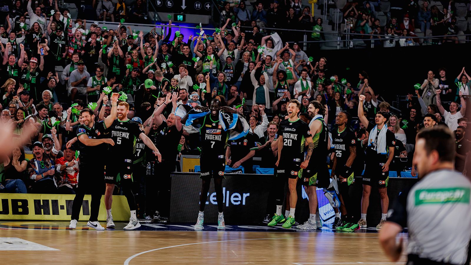 Phoenix players and supporters celebrating together at John Cain Arena