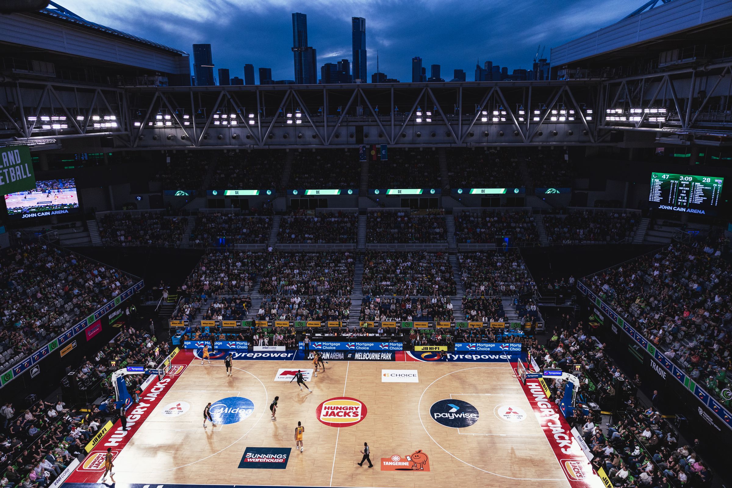 John Cain Arena from above with the roof open on game night